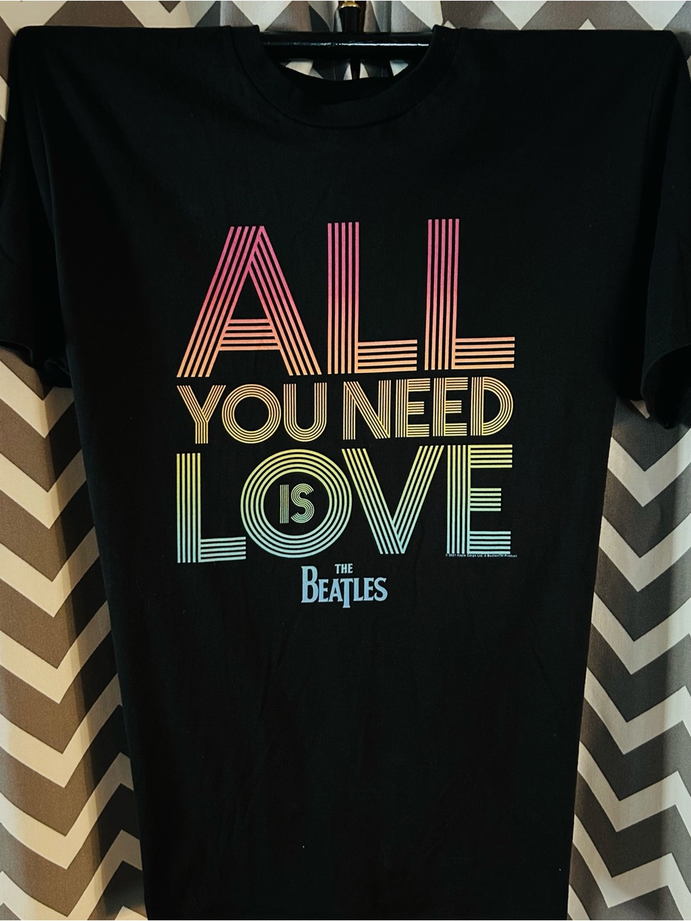 The Beatles Black Tee with Pink, Orange, Yellow, Green, Blue Gradient Text